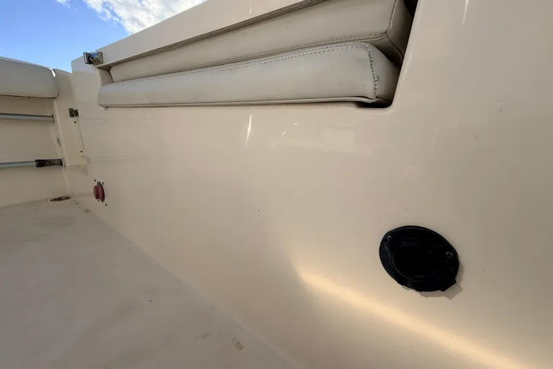 Slide: The Image of 2020 Cobia 220 Center Console boat interior with seating and deck details. - 10