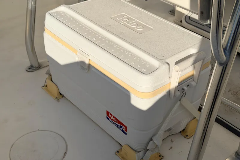 Slide: The Image of Igloo cooler on 2020 Cobia 220 Center Console boat deck. - 16