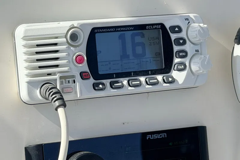 Slide: The Image of VHF radio on 2020 Cobia 220 Center Console boat dashboard. - 21