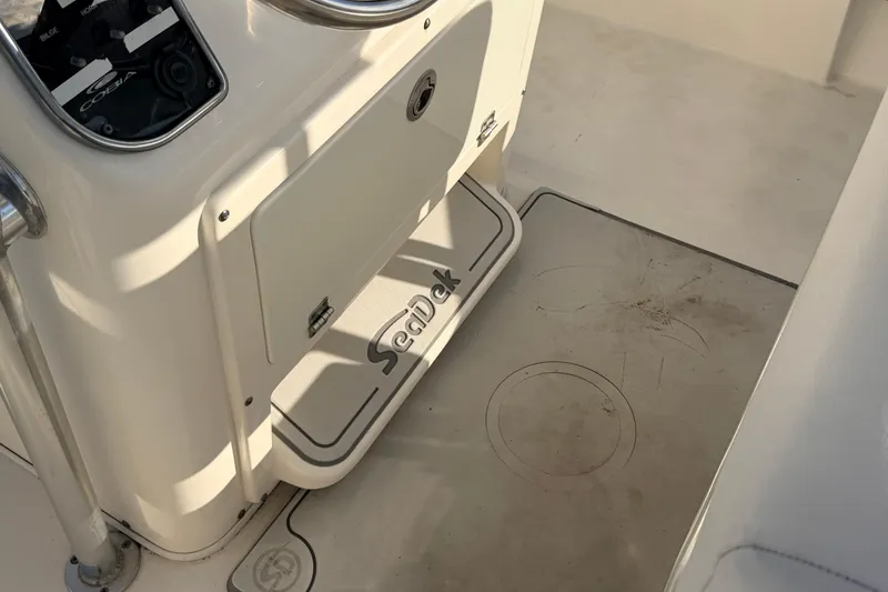 Slide: The Image of 2020 Cobia 220 Center Console boat interior with SeaDek flooring. - 25