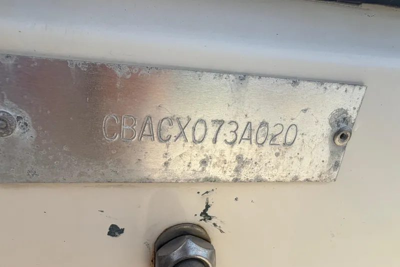 Slide: The Image of Hull identification number on a 2020 Cobia 220 Center Console boat. - 37