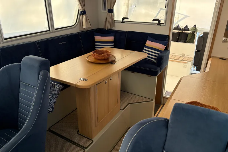 Slide: The Image of Interior of 2021 Sargo 36 boat with cozy seating and dining area. - 13