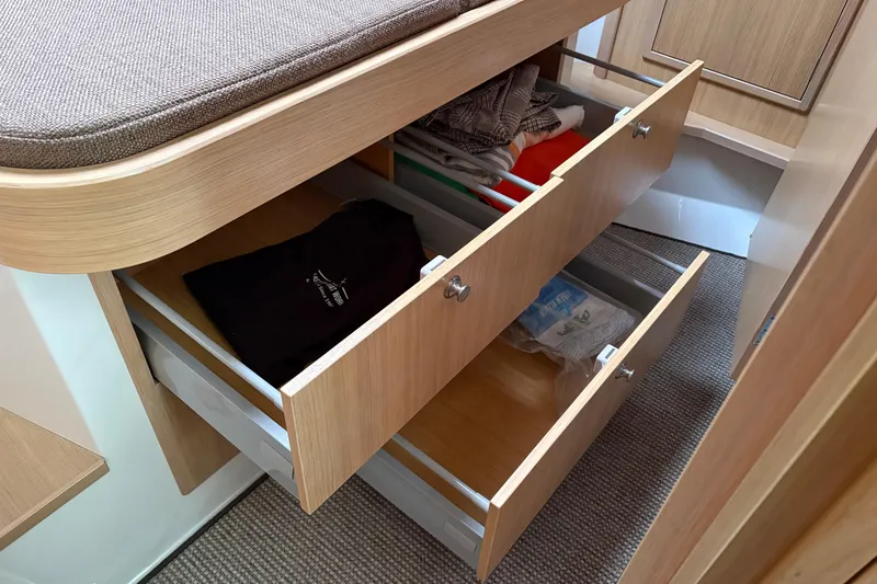 Slide: The Image of Interior storage drawers in 2021 Sargo 36 boat, featuring organized clothing and accessories. - 23