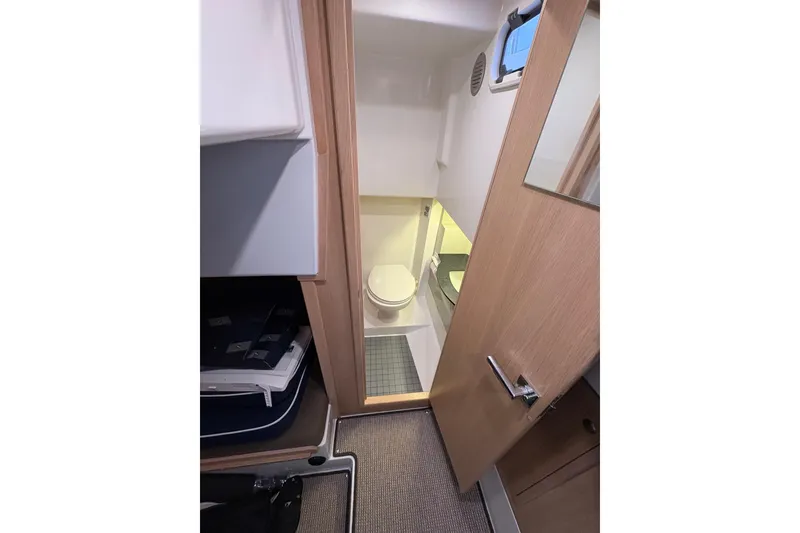 Slide: The Image of Compact bathroom in 2021 Sargo 36 boat, featuring modern fixtures and wooden accents. - 27