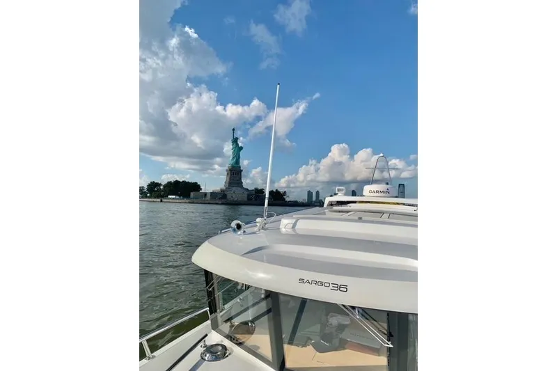 Slide: The Image of Sargo 36 boat near Statue of Liberty, clear sky, 2021 model. - 35