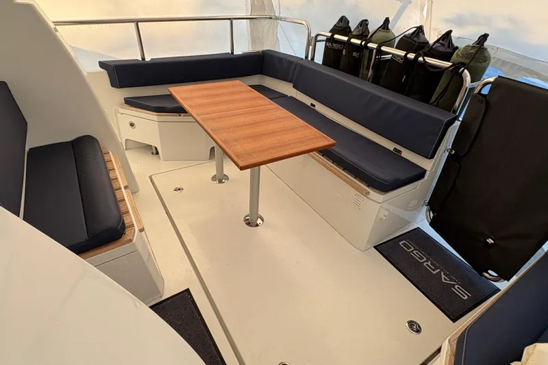 Slide: The Image of Interior of 2021 Sargo 36 boat with seating and wooden table. - 5