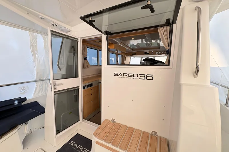 Slide: The Image of Interior view of 2021 Sargo 36 boat, featuring modern design and wooden accents. - 7