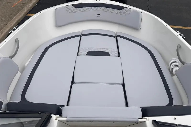 Slide: The Image of 2026 Bayliner M17 boat interior with cushioned seating and modern design. - 12