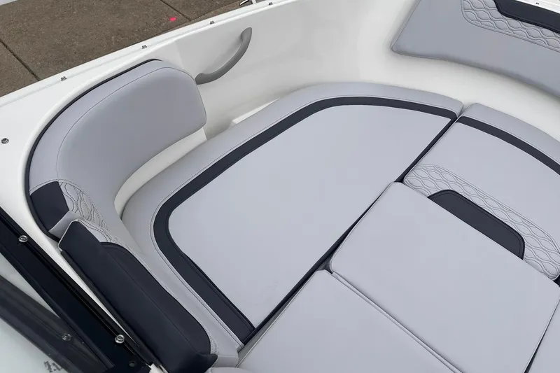 Slide: The Image of 2026 Bayliner M17 boat interior with sleek gray seating and modern design. - 13