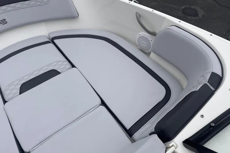 Slide: The Image of 2026 Bayliner M17 boat interior with sleek gray seating and integrated speaker. - 14