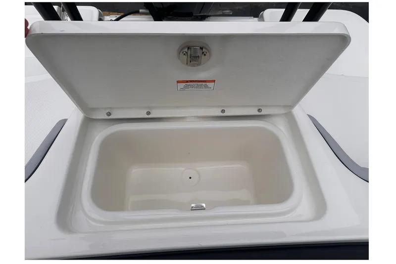 Slide: The Image of Open storage compartment on 2026 Bayliner M17 boat, showcasing interior space. - 15
