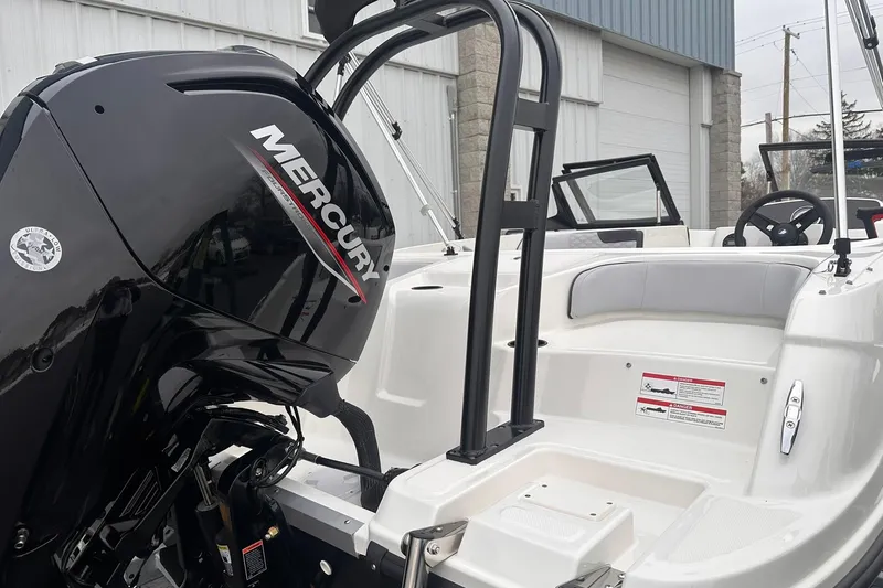 Slide: The Image of 2026 Bayliner M17 boat with Mercury engine, showcasing sleek design and modern features. - 17