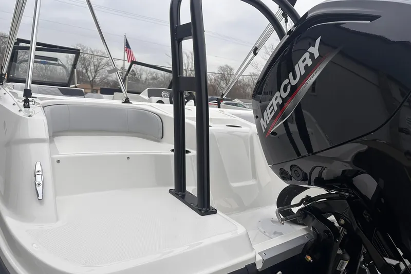 Slide: The Image of 2026 Bayliner M17 boat with Mercury engine, featuring sleek white interior design. - 18