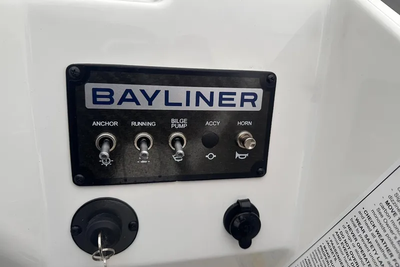 Slide: The Image of Control panel of 2026 Bayliner M17 boat with switches for anchor, running, bilge pump, and horn. - 19