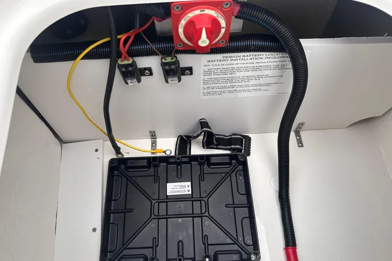 Slide: The Image of Battery compartment of 2026 Bayliner M17 boat with wiring and installation instructions. - 24