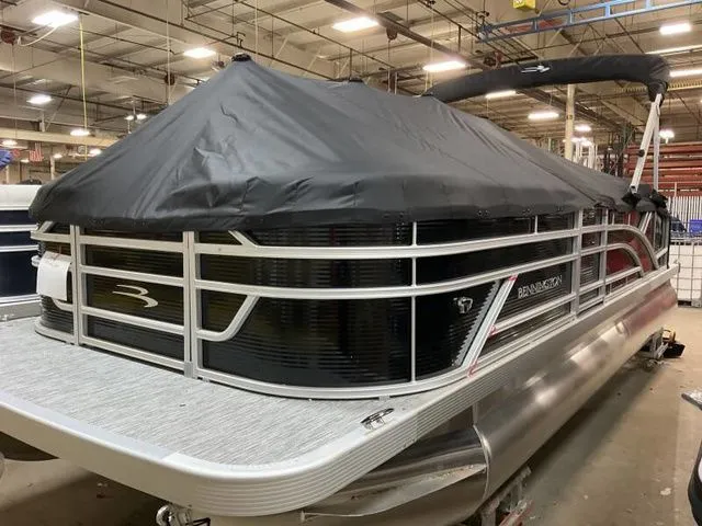 Slide: The Image of 2025 Bennington 22 SSB pontoon boat in warehouse. - 10