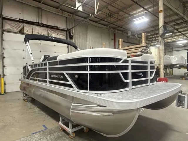 Slide: The Image of 2025 Bennington 22 SSB pontoon boat in warehouse. - 12