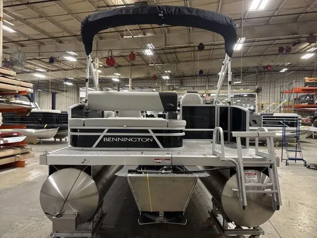 Slide: The Image of Bennington 22 SSB 2025 pontoon boat in a warehouse. - 4