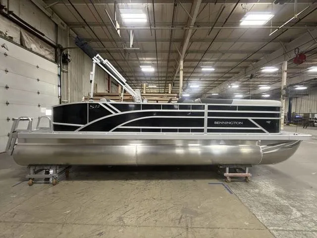 Slide: The Image of 2025 Bennington 22 SSB pontoon boat in warehouse. - 7
