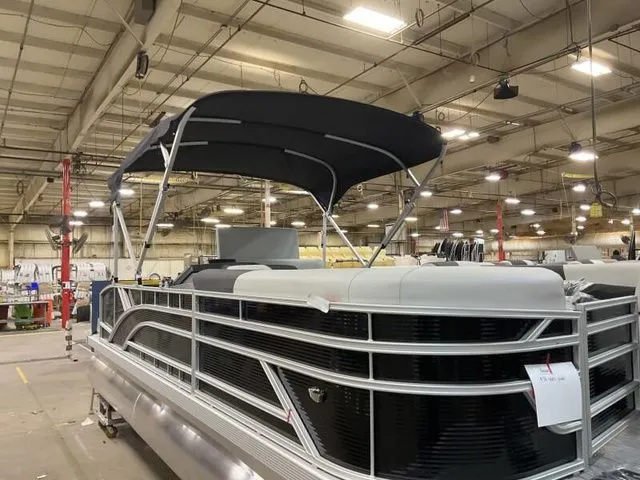 Slide: The Image of Bennington 22 SSB 2025 pontoon boat in a factory setting. - 8