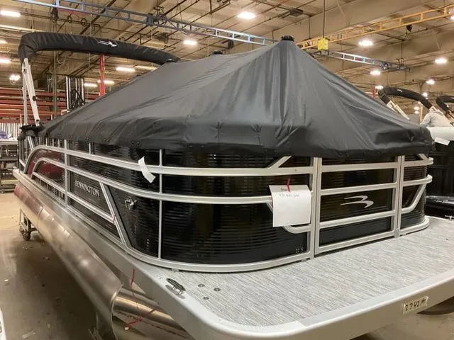 Slide: The Image of Bennington 22 SSB 2025 pontoon boat in warehouse, covered. - 9