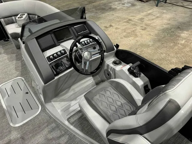 Slide: The Image of Interior of 2024 Bennington LXS Series 23 LXSSB with modern helm station. - 7