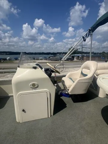 Slide: The Image of 2000 Bennington 2080 LX boat interior with steering wheel. - 13