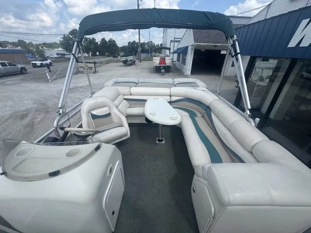 Slide: The Image of 2000 Bennington 2080 LX pontoon boat with seating area and table. - 9