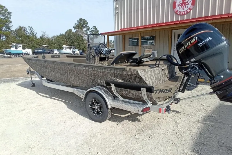 Slide: The Image of 2026 Thor 1900 Low Country Elite boat with Yamaha engine on trailer. - 13