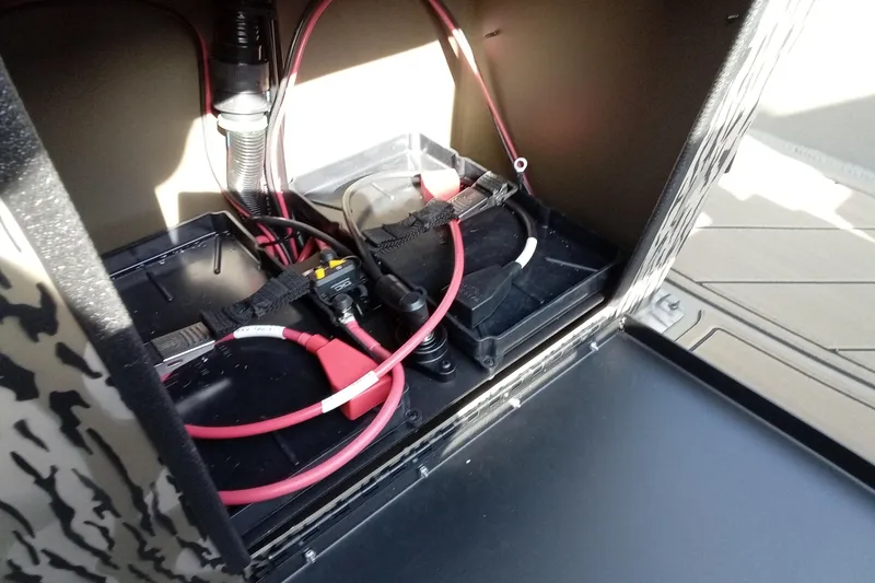 Slide: The Image of Battery compartment of 2026 Thor 1900 Low Country Elite with wiring and connections. - 15