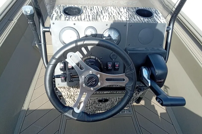 Slide: The Image of Steering console of 2026 Thor 1900 Low Country Elite boat with controls and gauges. - 16