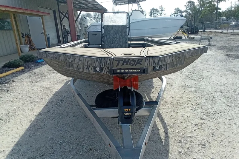 Slide: The Image of 2026 Thor 1900 Low Country Elite boat on trailer, outdoor setting. - 4