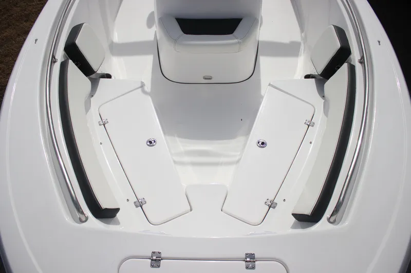 Slide: The Image of 2026 Tidewater 198 CC Adventure boat interior with white seating and storage compartments. - 10