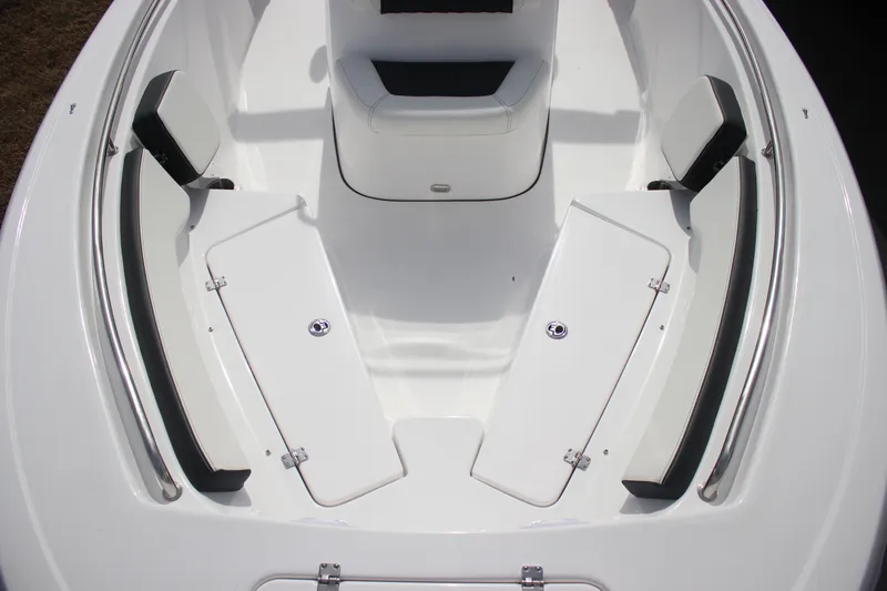 Slide: The Image of 2026 Tidewater 198 CC Adventure boat interior with white seating and storage compartments. - 11