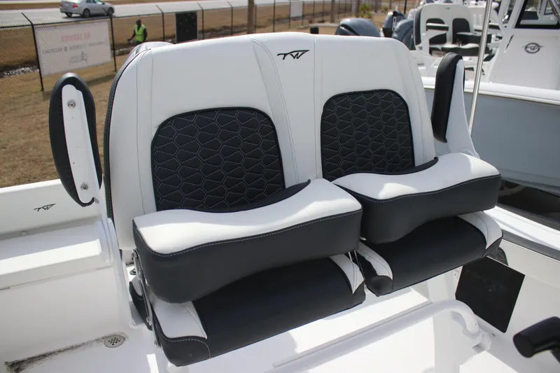 Slide: The Image of 2026 Tidewater 198 CC Adventure boat seats with black and white upholstery. - 15