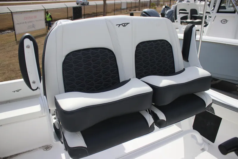 Slide: The Image of 2026 Tidewater 198 CC Adventure boat seats with black and white cushioned design. - 16