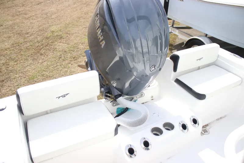 Slide: The Image of 2026 Tidewater 198 CC Adventure boat with Yamaha engine, featuring white seating and cup holders. - 17