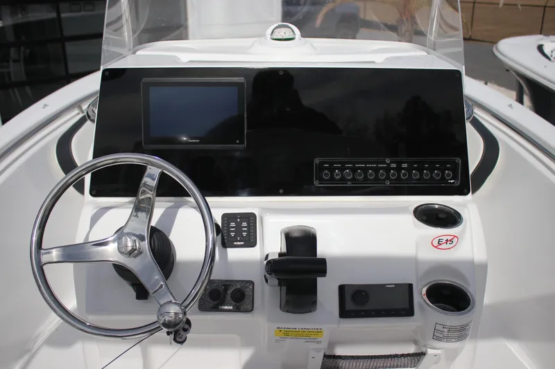 Slide: The Image of Center console of 2026 Tidewater 198 CC Adventure boat with steering wheel and controls. - 20