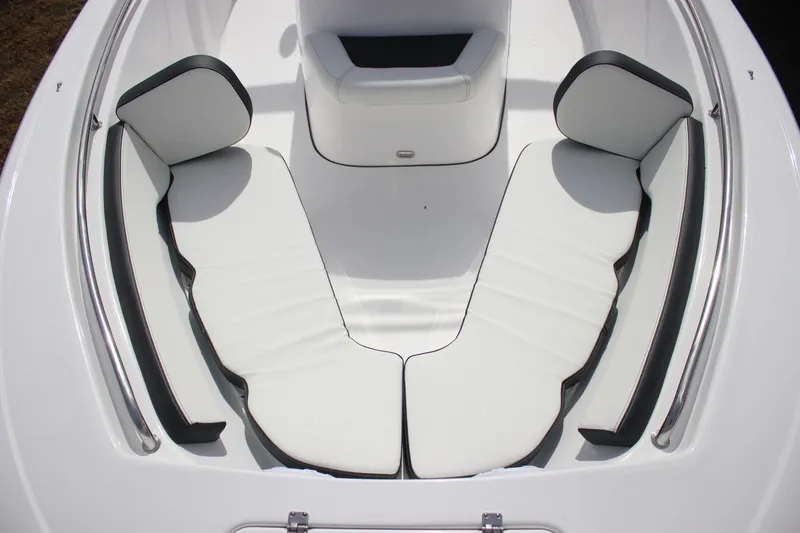 Slide: The Image of 2026 Tidewater 198 CC Adventure boat interior with white cushioned seating. - 22
