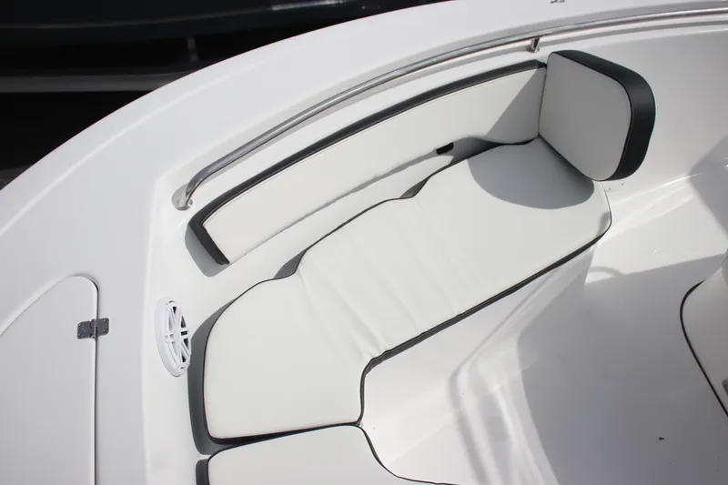 Slide: The Image of 2026 Tidewater 198 CC Adventure boat interior with white cushioned seating. - 23