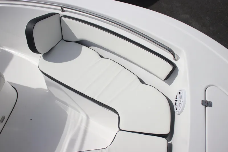 Slide: The Image of 2026 Tidewater 198 CC Adventure boat interior with white cushioned seating. - 24