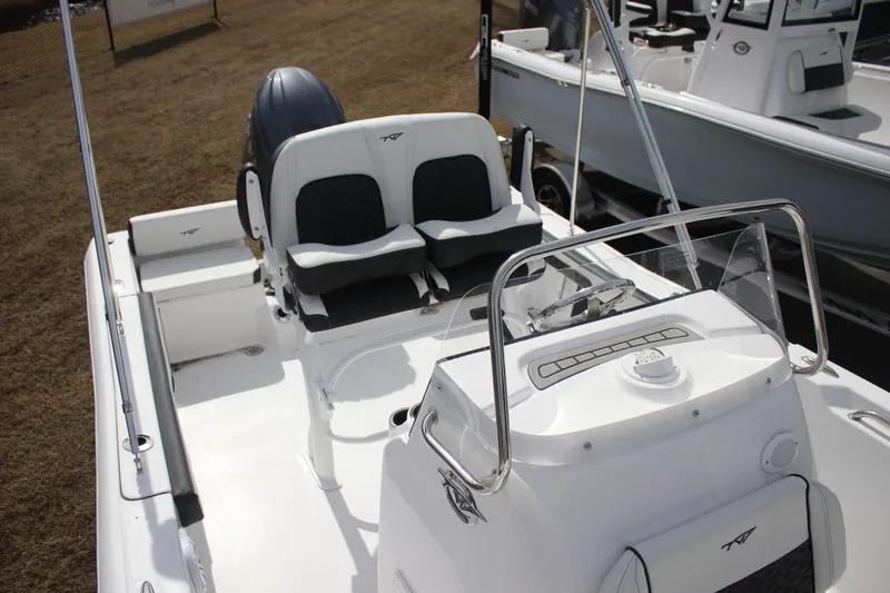 Slide: The Image of 2026 Tidewater 198 CC Adventure boat interior with dual seats and steering console. - 25