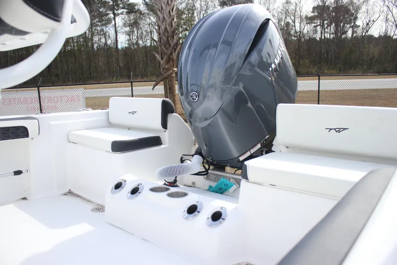 Slide: The Image of 2026 Tidewater 198 CC Adventure boat with Yamaha outboard motor, white seating, and rod holders. - 4