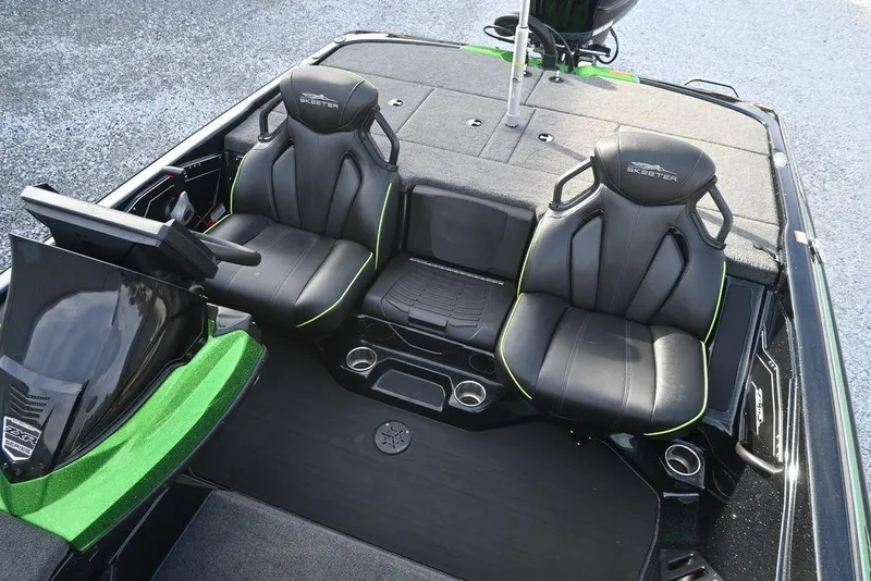 Slide: The Image of 2022 Skeeter ZXR20 boat interior with black seats and green accents. - 3