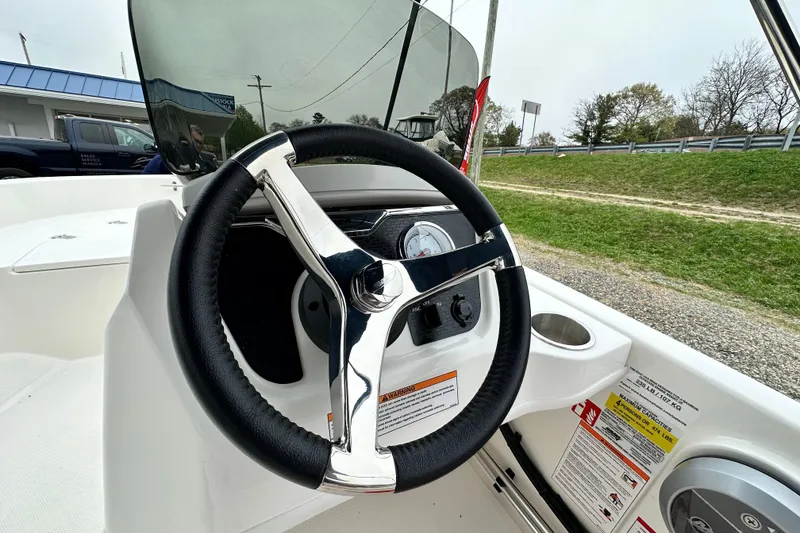 Slide: The Image of Steering wheel of the 2026 Boston Whaler 130 Super Sport. - 17