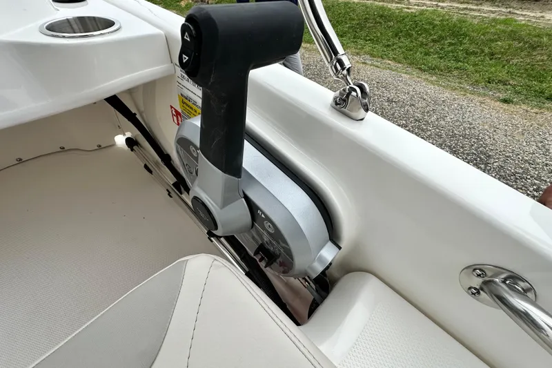 Slide: The Image of Interior view of Boston Whaler 130 Super Sport 2026 throttle control. - 18