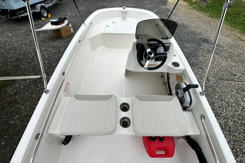 Slide: The Image of Interior view of the 2026 Boston Whaler 130 Super Sport boat. - 20