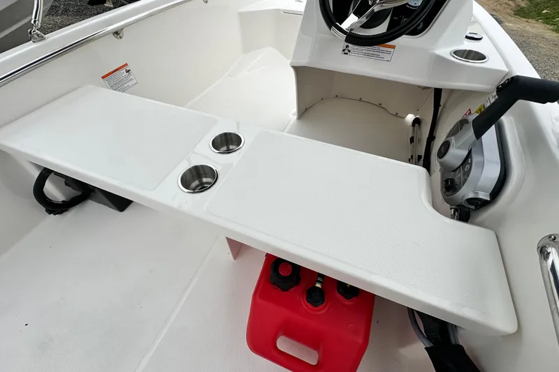 Slide: The Image of Interior of 2026 Boston Whaler 130 Super Sport with steering console. - 22