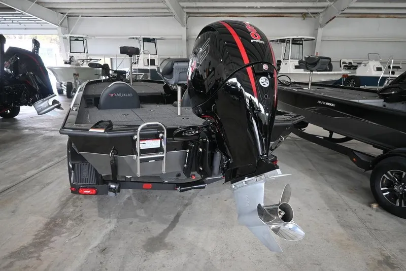 Slide: The Image of 2026 Vexus AVX 1980 boat with powerful outboard motor in showroom. - 2