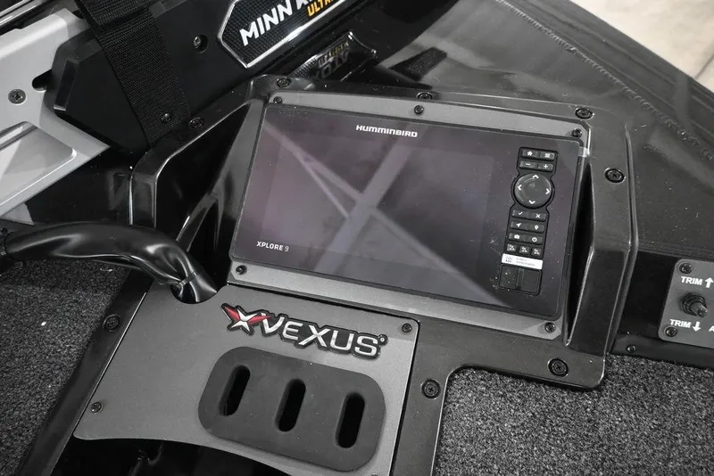 Slide: The Image of 2026 Vexus AVX 1980 boat dashboard with Humminbird Xplore 9 display and Minn Kota controls. - 7